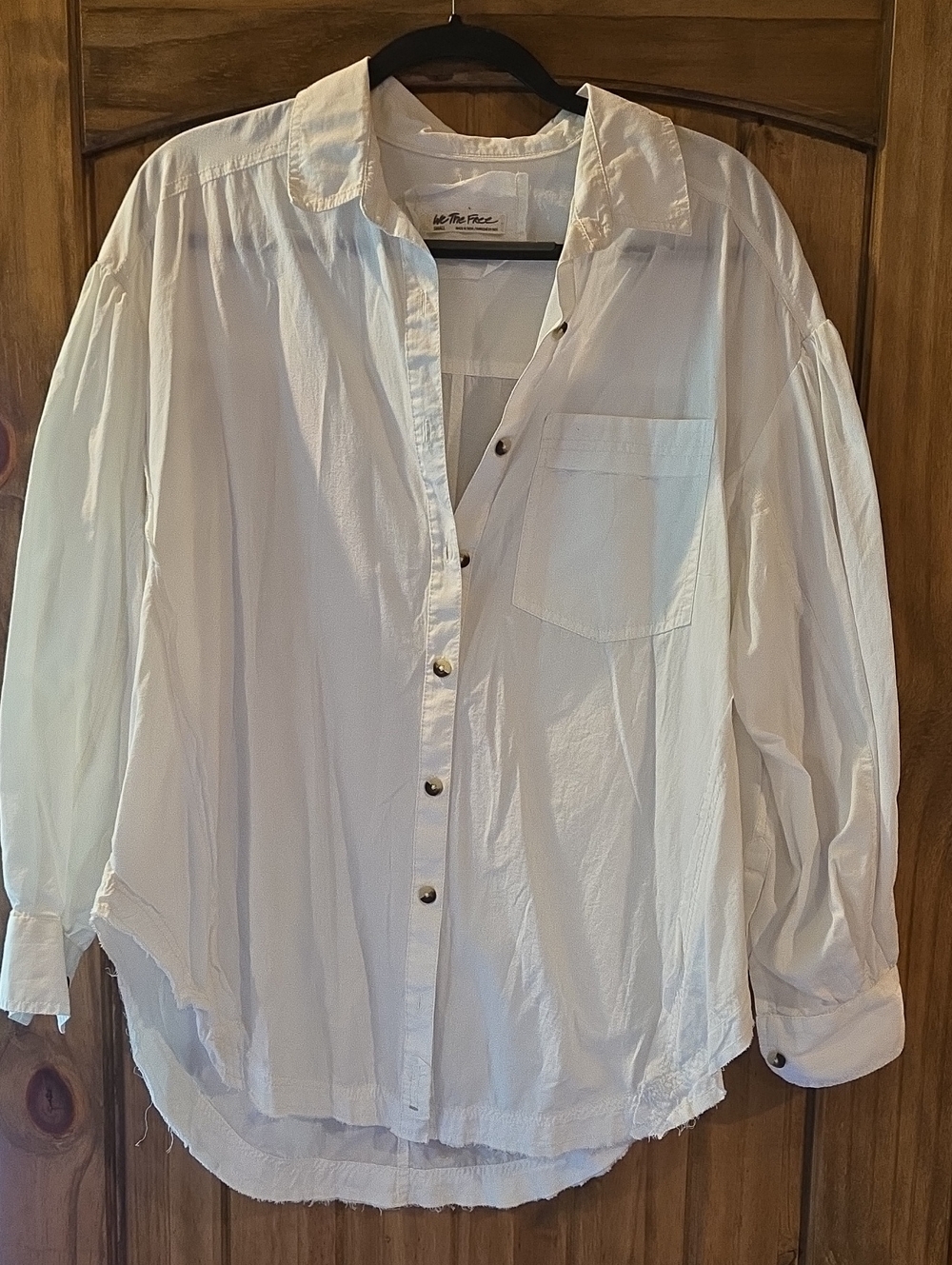 We The Free white woven top with branded label